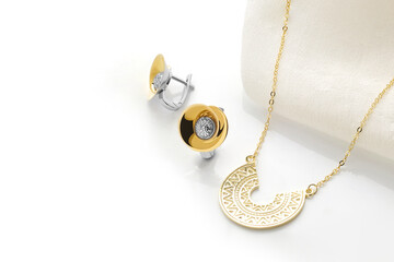 Elegant jewelry set. Jewellery set with gemstones. Product still life concept. Ring, necklace and...