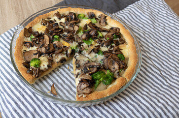 Quiche with mushrooms and broccoli.
