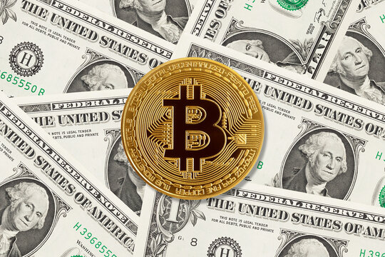 gold coin bitcoin, against the background of dollars