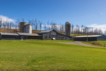 Barns and silo sit on a hillside in rural Virginia, USA.