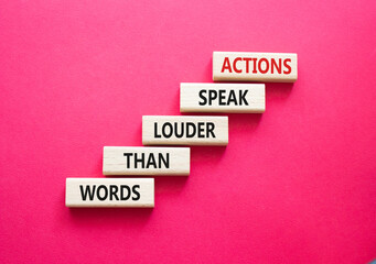 Actions speak louder than Words symbol. Wooden blocks with words Actions speak louder than Words....
