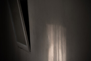 exposure to morning sunlight on the walls of a dark room.