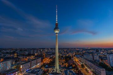 Evening mood of the Berlin skyline at the blue hour. Illuminated television tower at Alexanderplatz...