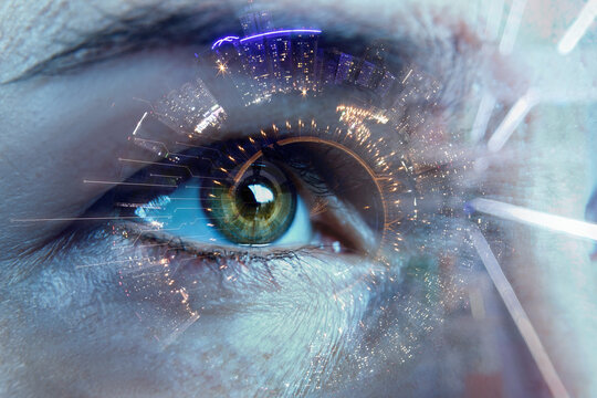 Double exposure of the eye and the city panorama.