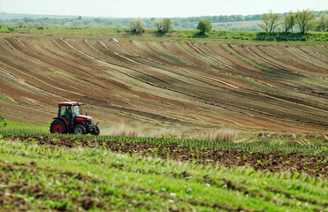 Tractor on a striped field, Seasonal Agriculture: Tilling the Fertile Fields,  Farming, Earth's  Bounty, Educational Materials, Agricultural Equipment Advertisements, Environmental Studies,
