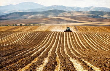Tractor on a striped field, Seasonal Agriculture: Tilling the Fertile Fields,  Farming, Earth's  Bounty, Educational Materials, Agricultural Equipment Advertisements, Environmental Studies,