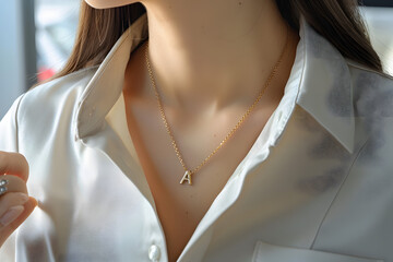 
gold initial A necklace pendant of  A on women neck - obrazy, fototapety, plakaty