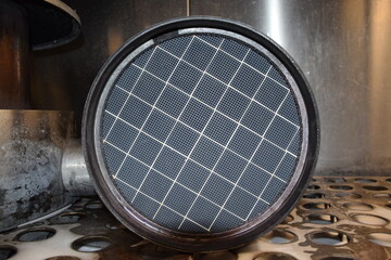 Truck DPF closeup, FAP, Diesel Particulate Filter, clean filter DPF from truck from above.
