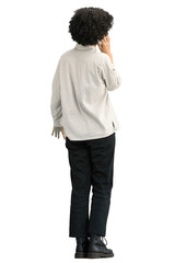 A woman, full-length, on a green background, with a phone