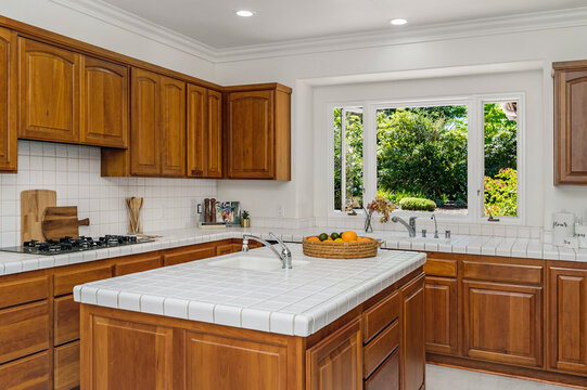 this is an image of a clean kitchen in the daytime