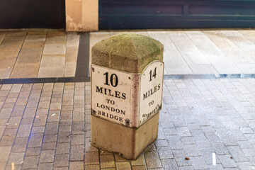 milepost in london marking the distance to London Bridge