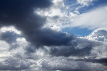 Storm clouds on the sky, torn textured clouds on a blue sky