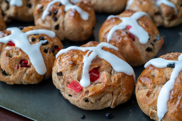 Homemade traditional hot cross buns with fruit and raisins. - 767405134