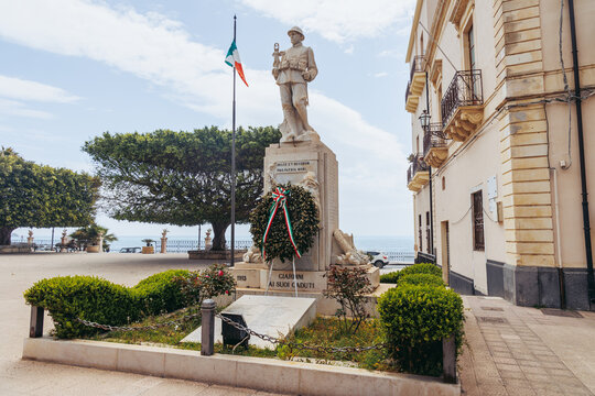 Giardini Naxos, Italy - May 7, 2022: First World War Memorial on Town Hall Square in Giardini Naxos in the Metropolitan City of Messina on the island of Sicily, Italy