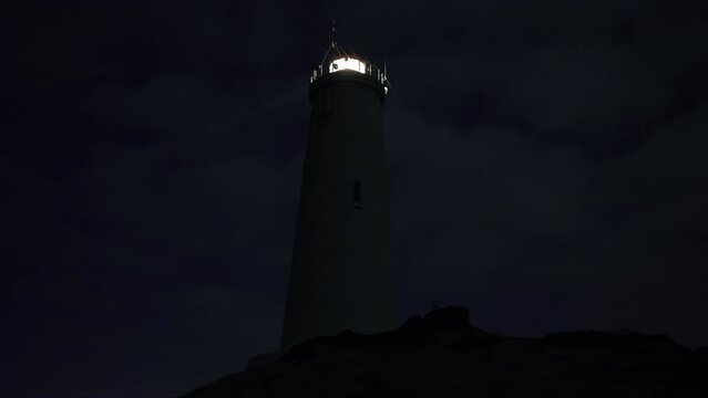 Reykjanesviti lighthouse Iceland at night close-up on rock mound