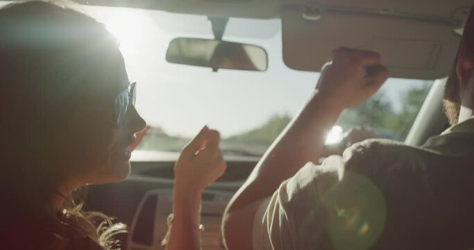 Driving, car and couple dance on road trip, street journey or summer travel for fun romantic adventure on Canada vacation. Transport vehicle, radio music and back of marriage people listening to song