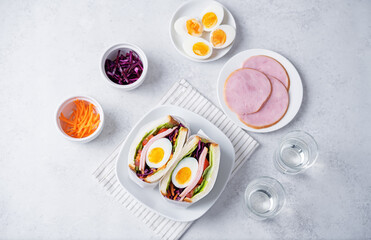 Japanese Wanpaku sandwich with egg, red cabbage and ham