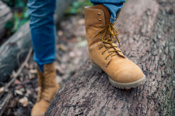 Close-up view of the boots worn by the lumberjack.