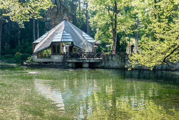 Day at Rybárska Bašta: Rajecke Teplice, Slovakia Spa park with lake with summer green trees