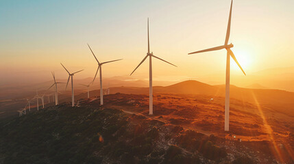 Wind turbines at sunset representing renewable energy solutions. - obrazy, fototapety, plakaty