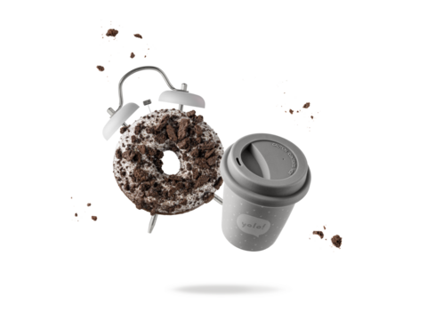 Time for coffee break and snack dessert. Sweet white chocolate glazed donut as alarm clock and coffee cup togo flying with cookies crumbs