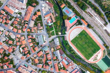 Aerial top view of the city and sports recreation fields ground, city stadium