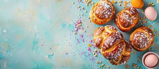 Foto op Plexiglas Easter-themed arrangement featuring traditional Orthodox sweet bread, kulich, and eggs on a bright backdrop. Concept for Easter holiday breakfast with space for text. © Vusal