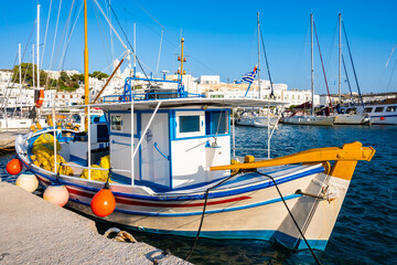 Traditional Greek fishing boat in Adamas port, Milos island, Cyclades, Greece - 767422395