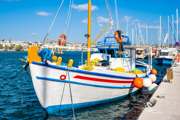 Traditional Greek fishing boat in Adamas port, Milos island, Cyclades, Greece - 767422516