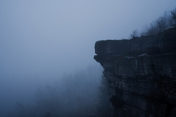 Gloomy and totally moody view in the foggy rocks with the best dark and mystic atmosphere in the north of Bohemia.