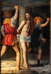 MILAN, ITALY - MARCH 7, 2024: The renaissance painting of Flagellation - Cappella della Passione in San Giorgio in Palazo church by Bernardino Luini (1516).
