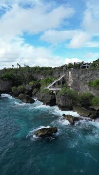 Aerial video above the coastline with rocks and observation in Ilocos Sur Philippines