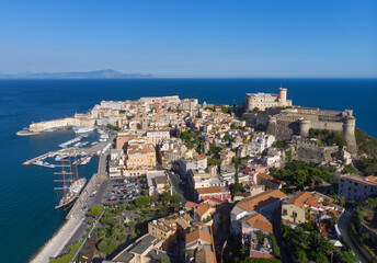 Fototapeta na wymiar Panorama of Gaeta city, port and sea from drone. sunny day, blue sky and blue water in the sea. the ship is docked in the port of the old city. the Apennine Mountains are far in the background
