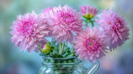  a vase filled with pink flowers sitting on top of a table next to a green vase filled with pink flowers.