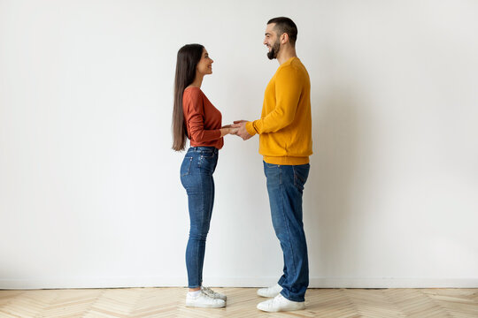 Two people holding hands with blurred faces