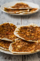Delicious Home Made Lahmacun, Traditional Turkish Pizza Served on a Wooden White Background