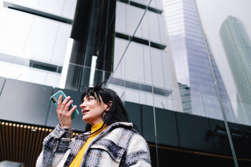 Woman Talking on Phone in Modern Cityscape