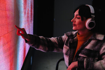 Curious Woman in Wheelchair at Digital Art Exhibition