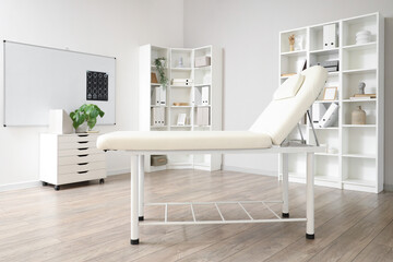 Interior of neurologist's office with medical couch and shelf units - obrazy, fototapety, plakaty