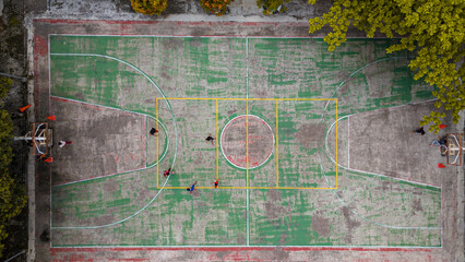 Aerial view on a basketball court on the street. Top view of basketball court
