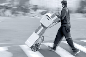 delivery with dolly by hand in monochrome