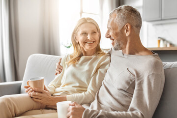 Couple sharing a moment with coffee cups