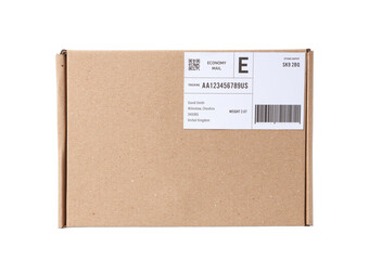 Cardboard package with shipping label and barcode on white background