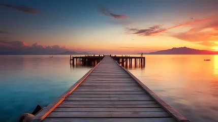 Tuinposter Wooden pier on the lake at dawn © xuan