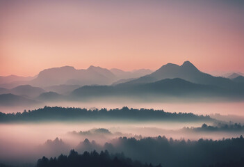 Fototapeta premium Misty sunrise silhouette over a mountain range pastel colours