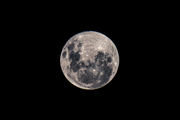 Full Moon Worm Moon rising in the night sky