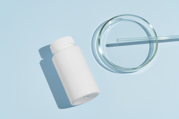 White pill jar and petri dish mockup on blue isolated background. Concept of pharmacy, medical technology and health