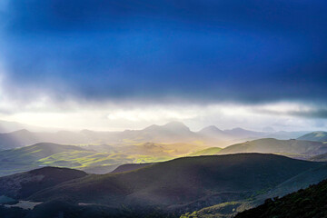 Clouds above the rolling hills, valley, mountains