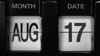retro flip calendar with a date change from the sixteenth of August to the seventeenth of August. daily calendar with a change of days of the month. close up.