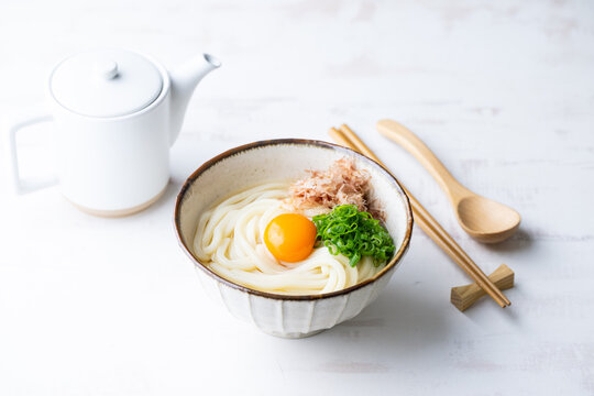 udon noodle with green onion, bonito powder and egg yolk